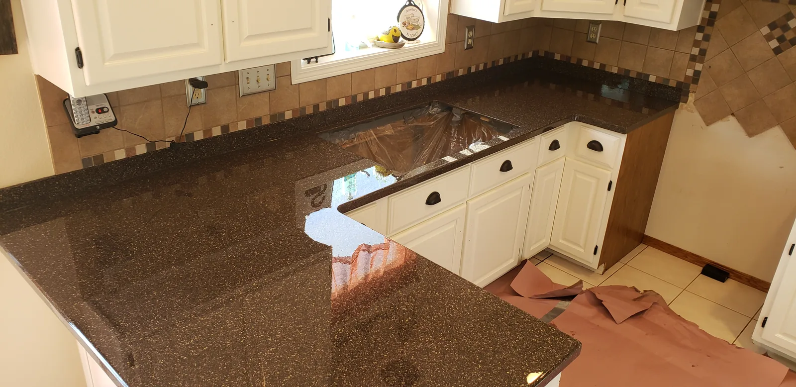 Epoxy restored kitchen countertops in a brown granite look, full kitchen view by DC Coatings, Green Bay, WI