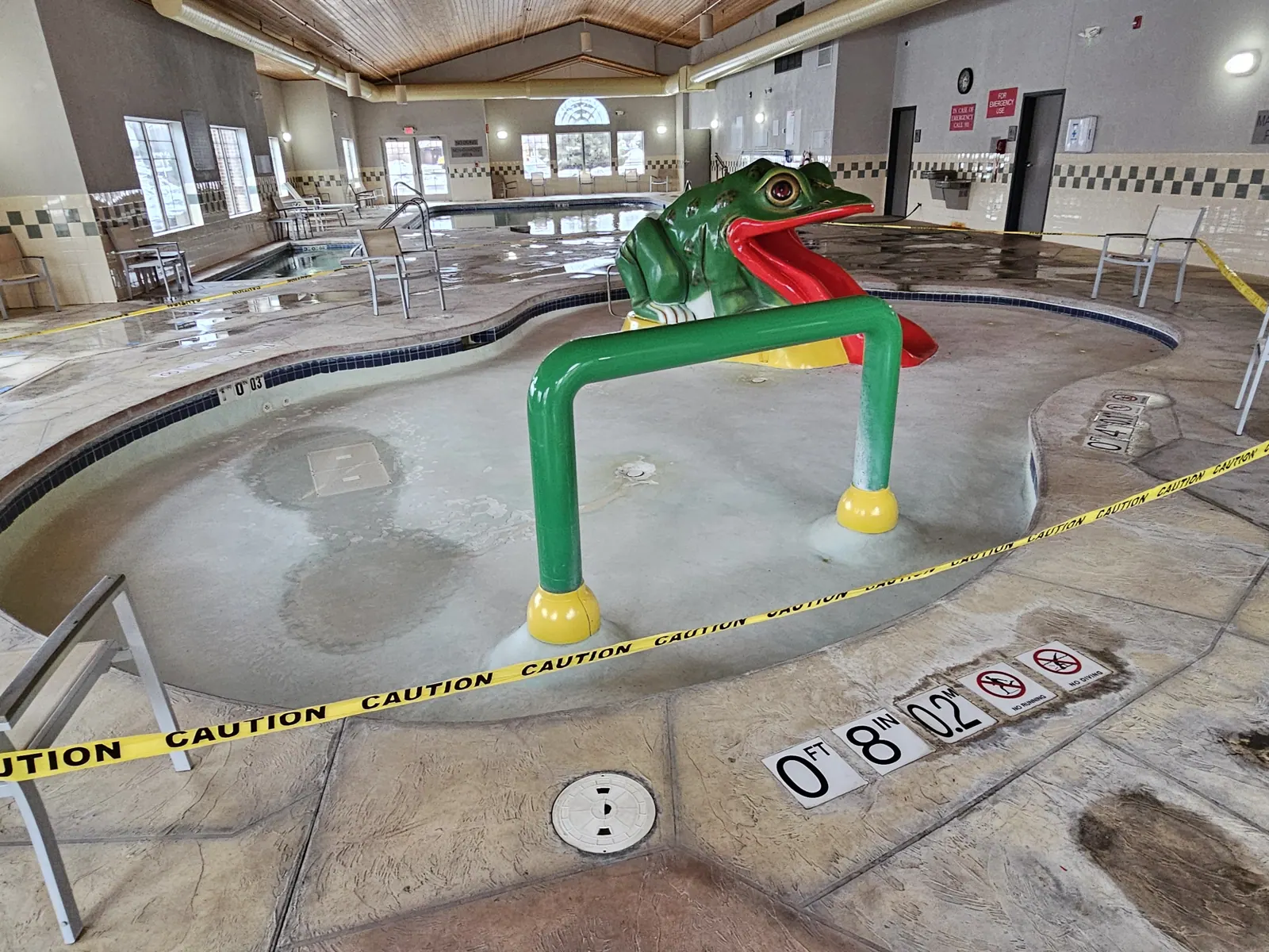 Comfort Inn hotel kids splash pool with frog slide before coating by DC Coatings